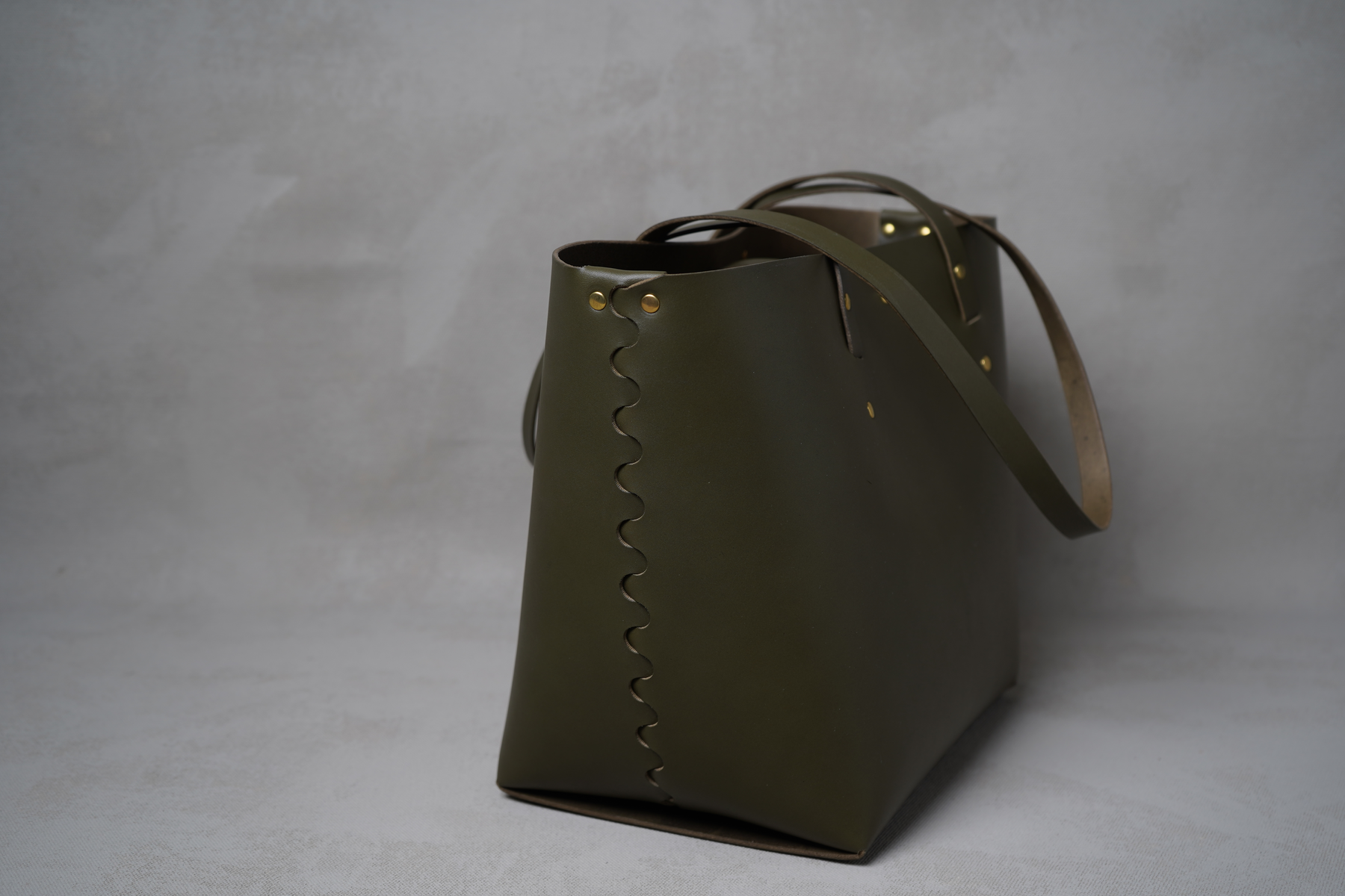 Lille flettet skuldertaske i læder, Grøn